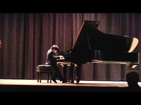 a pianist performing on stage