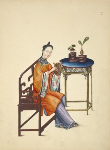 Woman playing a small hand drum