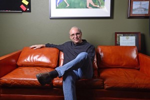 Bob Duke in his office seated on the burnt orange leather couch that was given to him by legendary Longhorn Band director Vincent DiNino. Photo by Marsha Miller.