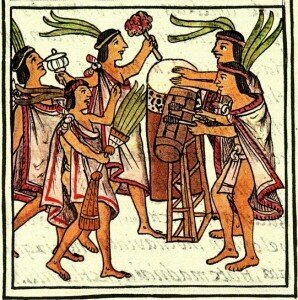 Aztec musicians playing teponaztli (foreground) and tlapanhuéhuetl 
