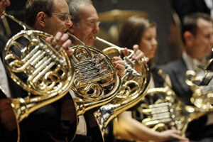Brass players have to hold heavy instruments in awkward positions for long periods of time.