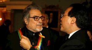 Leon Fleisher is greeted by Yo Yo Ma after receiving the Kennedy Center honors AP Photo/Jose Luis Magana