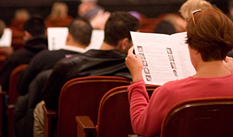 Concert audience reading program notes