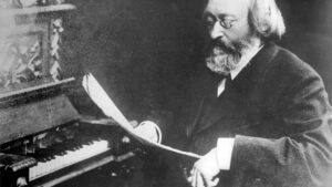 Max Bruch looking at a music score