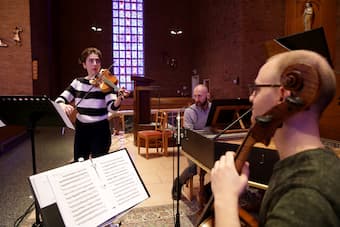 Alana Youssefian warms up with Michael Sponseller and Matt Zucker before a recording session at St. Rose of Lima Church in Haddon Heights.