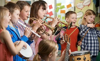 Group music lessons and classes encourage collaboration while also teaching children to appreciate their individual part in a larger ensemble 