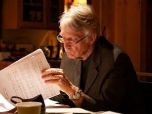 Composer studying and reading his scores