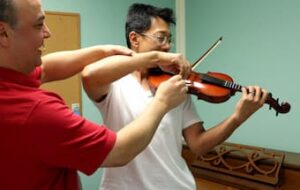 Addressing back pain for violinist