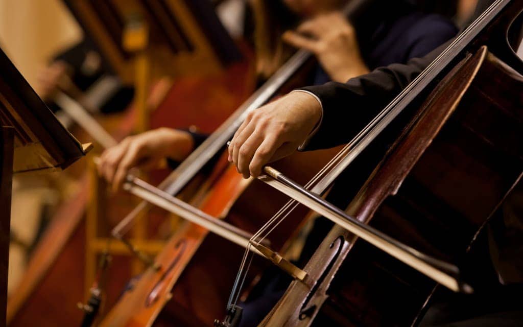 Playing cello solo in an orchestra