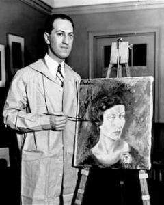 George Gershwin in his New York apartment with his first oil painting.