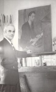 Roman Maciejewski against his portrait by Zdzislaw Ruszkowski