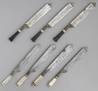 The 7 knives at the Musée national de la Renaissance with musical scores engraved on each of them