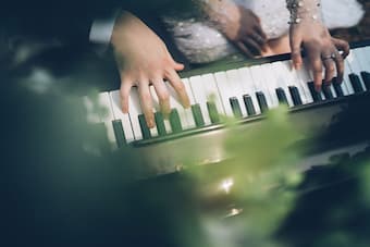 wedding couple playing piano