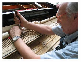 Franz Mohr tuning a piano