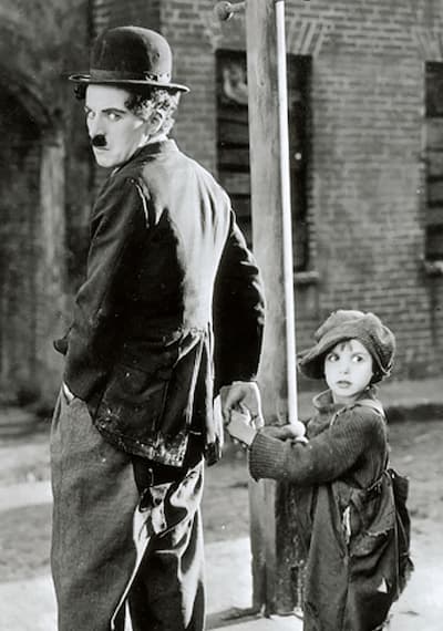 Charlie Chaplin with Jackie Coogan in The Kid, 1921