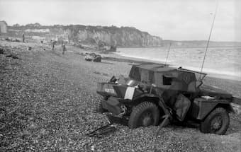 Dieppe's chert beach and cliff immediately following the raid on 19 August 1942. A Dingo Scout Car has been abandoned. (Bundesarchiv, Bild 101I-362-2211-04 / Jörgensen)