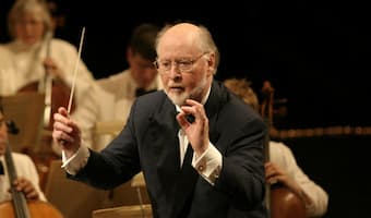 John Williams - Look at his instrumental concertos and friendship with classical musicians