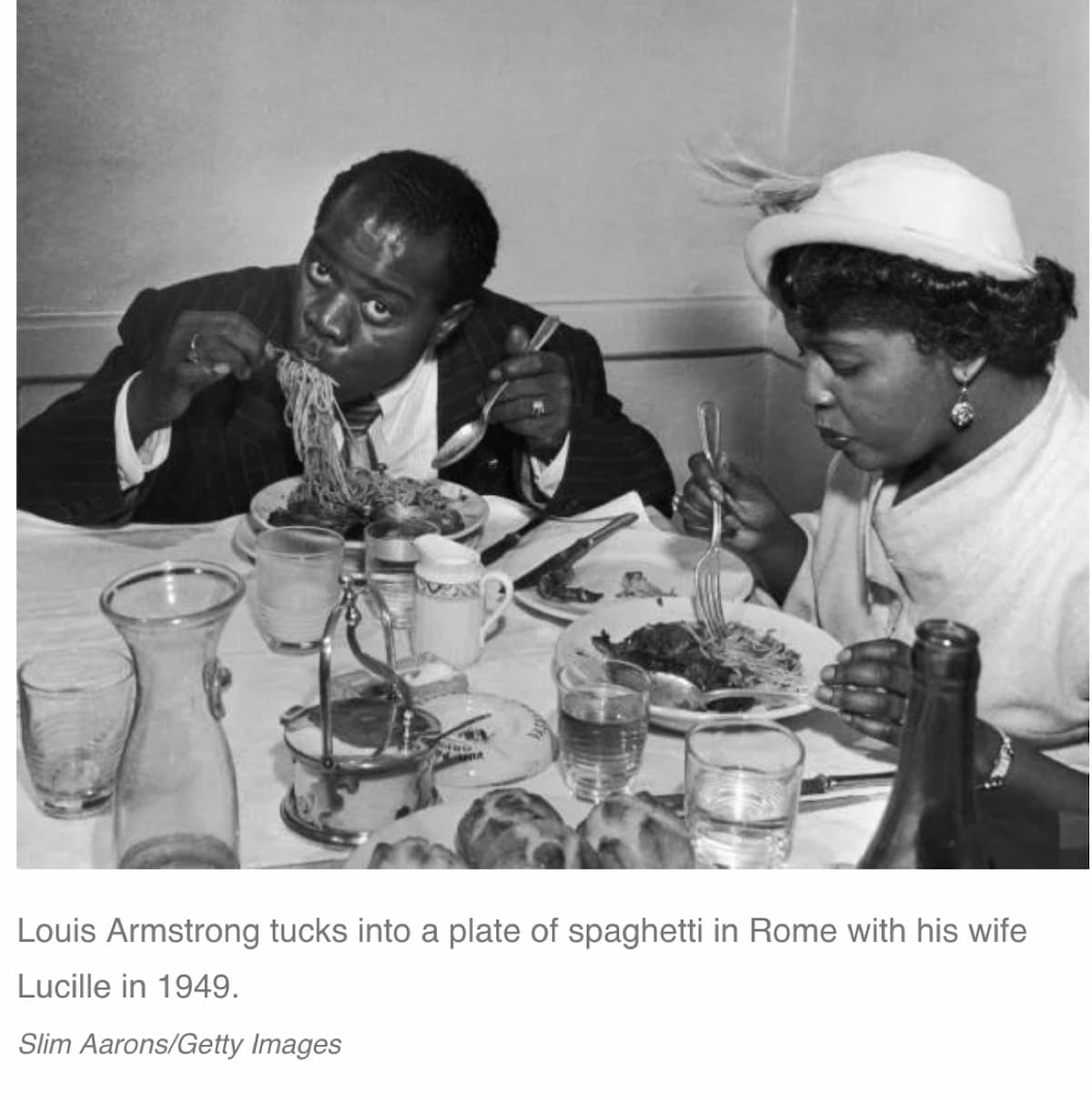 Photo of Louis Armstrong eating pasta