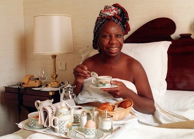 Nina Simone enjoying breakfast in bed