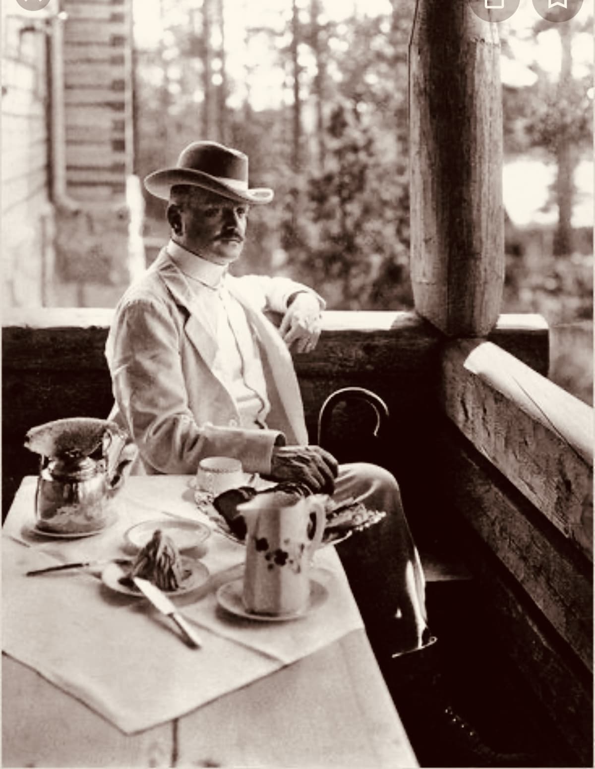 Composer Jean Sibelius having a tea