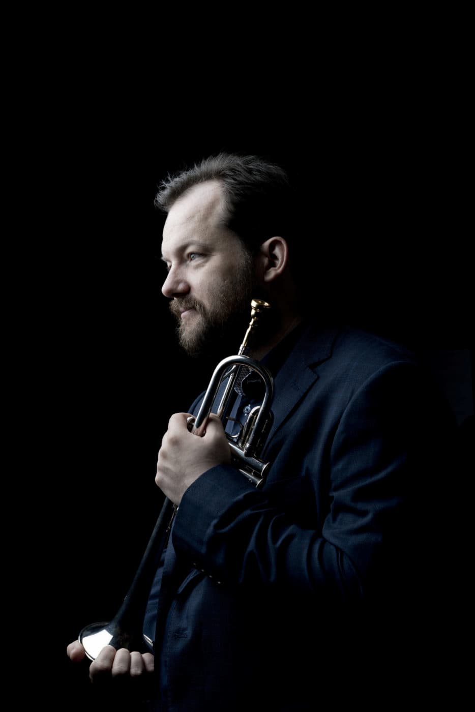 Andris Nelsons holding a trumpet