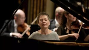 Pianist Maria João Pires performing with an orchestra