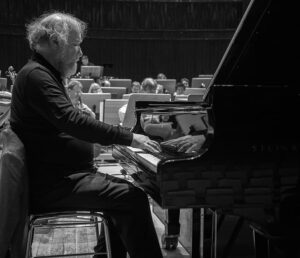 black and white photo of Radu Lupu playing the piano in 2012