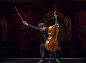 Photo of cellist Jean-Guihen Queyras' finishing pose after his solo performance