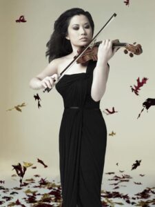 Violinist Sarah Chang performing in a black gown
