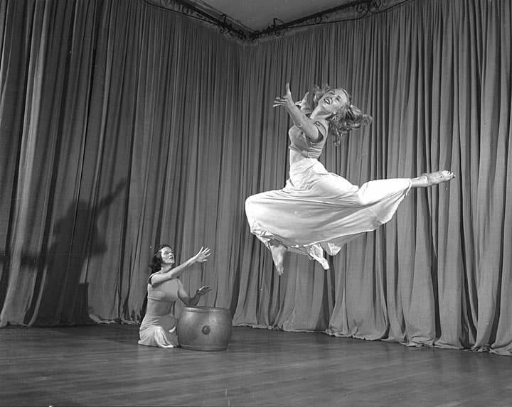 black and white photo of women's interpretive dance with instrumental accompaniment