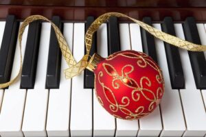 Christmas ornament on piano keys
