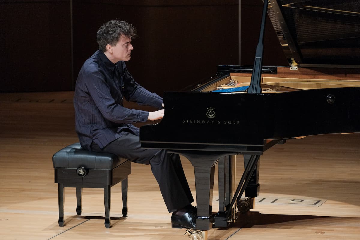 Paul Lewis performing at the piano