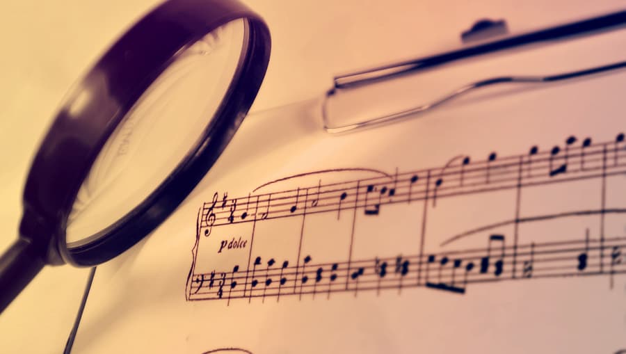 Magnifying glass on music score