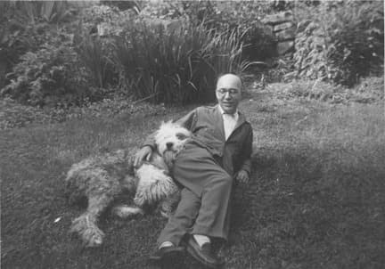 Kurt Weill with his Old English Sheepdog named Wooly at Brook House, ca. 1948