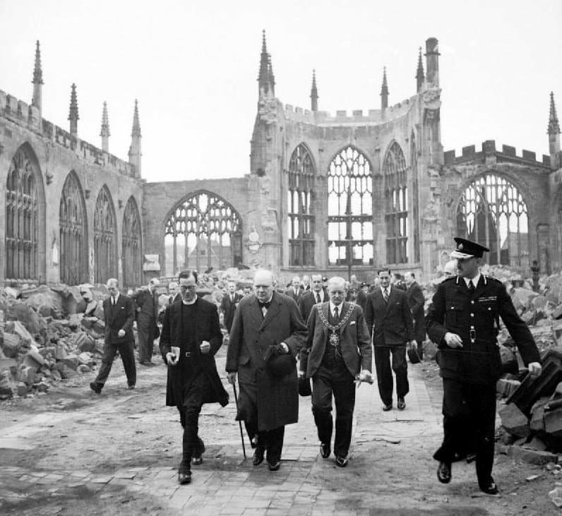 Winston Churchill, the Mayor J A Moseley, the Bishop of Coventry M G Haigh, the Deputy Mayor A R Grindlay, and others visiting the ruins of Coventry Cathedral in September 1941 (Imperial War Museum)