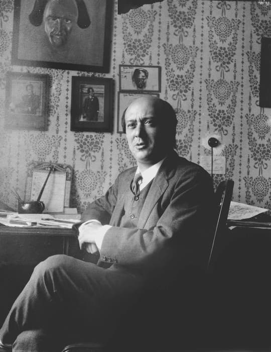 Arnold Schoenberg, 1911 (note pictures of Mahler over his desk)