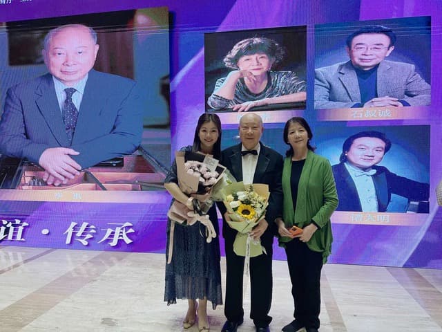 Vivian and her parents. It was taken after her father’s 80th Birthday Recital, featuring himself with his old pianist friends and some of his most significant students, including Vivian