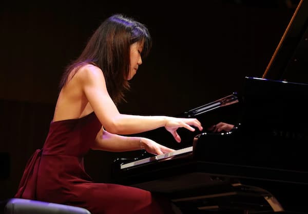 Pianist Kate Liu performing at the piano