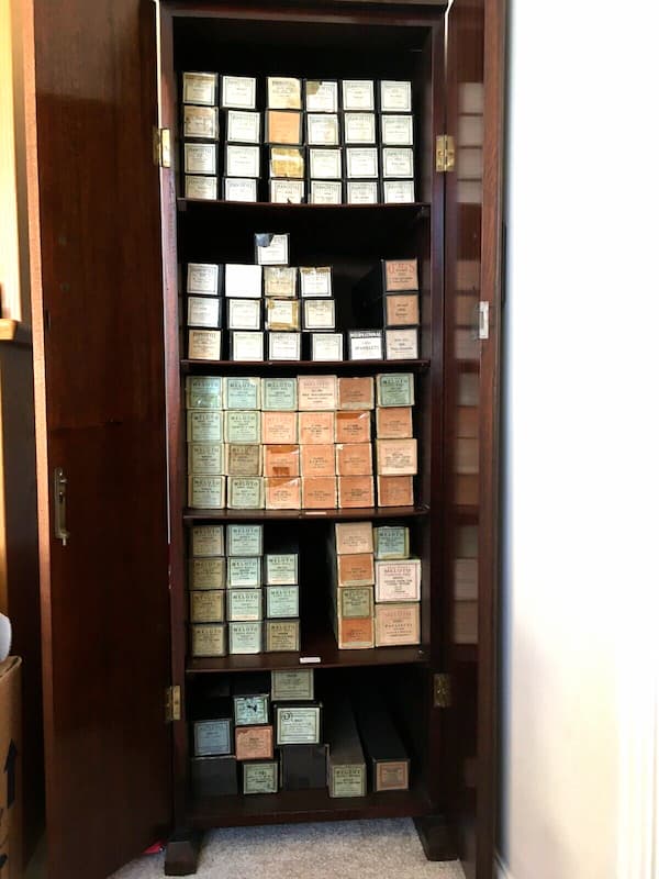 Piano roll boxes in their cabinet