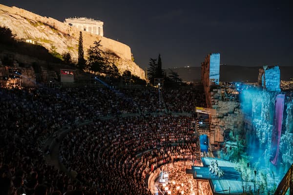 The Odeon stage built out over the orchestra. Chorus standing in the audience, 2025 (Photo by G. Antonoglou) (Greek National Opera)