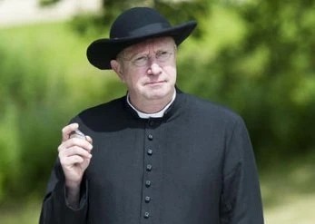 Actor Mark Williams as Father Brown