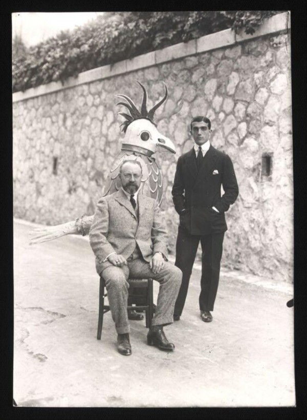 Henri Matisse (seated) and Léonide Massine shown with the mechanical nightingale, 1920