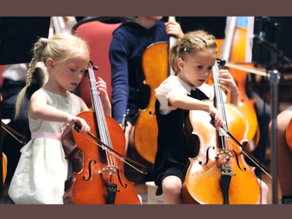 children playing cello together