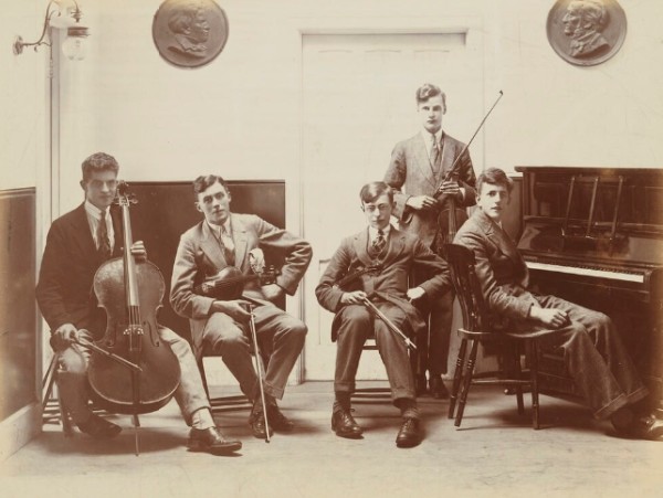Peter Burra standing next to Peter Pears at the piano
