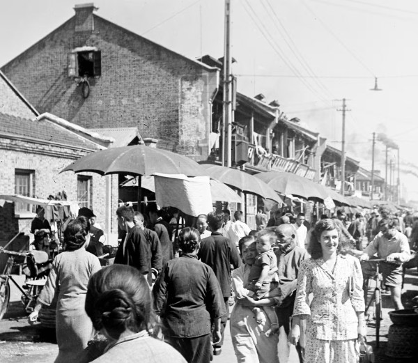 Jewish refugees and their Chinese neighbors at a market in Hongkou