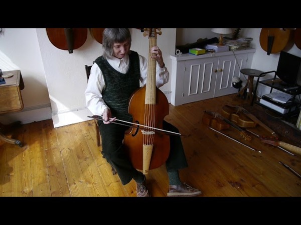 Bass violist Alison Crum holding her bass viol
