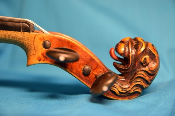 (Carved head of lion from a typical Stainer violin)